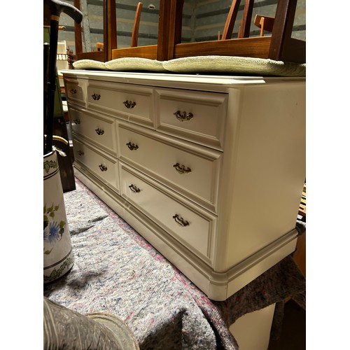 155 - A pair of white painted lowboy chests of seven 142 x46x69