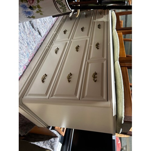 155 - A pair of white painted lowboy chests of seven 142 x46x69