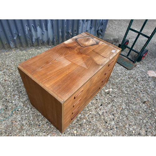 102 - A mid century teak chest of five drawers