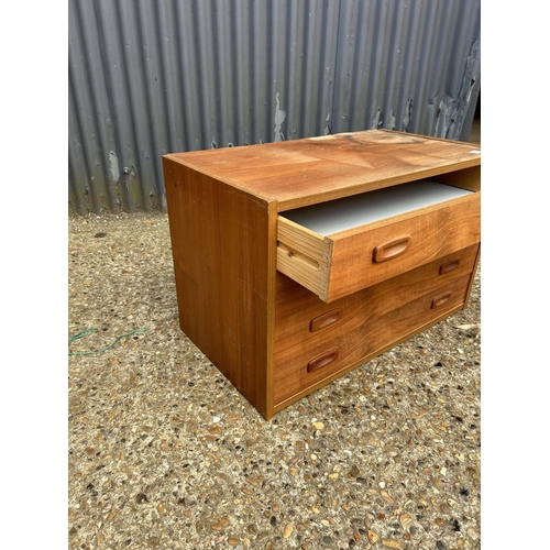 102 - A mid century teak chest of five drawers