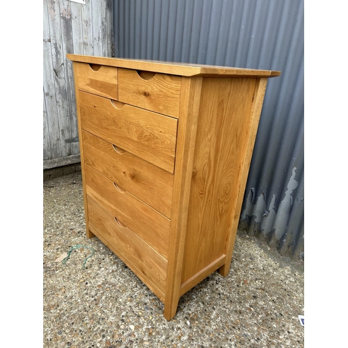 109 - A modern light oak chest of six drawers 87x46x106