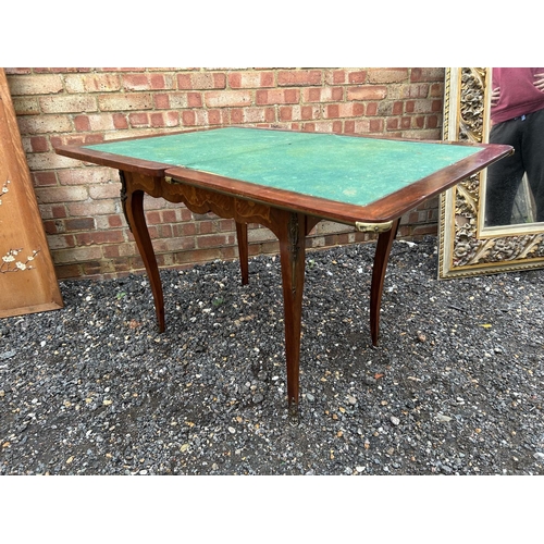 11 - A French Louis XV style rosewood and marquetry games table height 79cm, width 82cm, depth 58cm