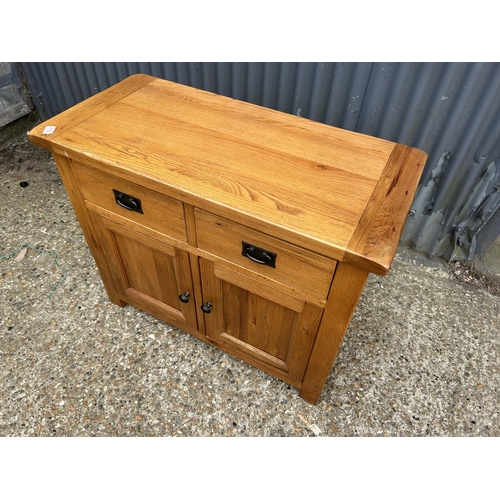 112 - A modern light oak two drawer sideboard 99x48x80