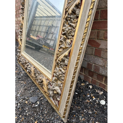 12 - A large George III style grey painted and gilt decorated mirror height 180cm, width 124cm