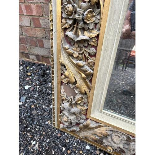 12 - A large George III style grey painted and gilt decorated mirror height 180cm, width 124cm