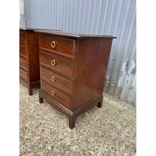 141 - A pair of stag four drawer bedside chests