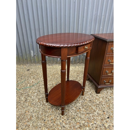 143 - A reproduction chest of four together with a single drawer occasional table