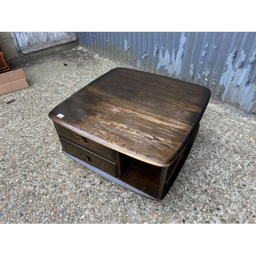 144 - A dark ercol pandora two drawer coffee table