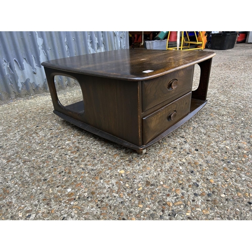 144 - A dark ercol pandora two drawer coffee table