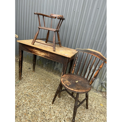 148 - A vintage country pine table, two chairs and a childs chair