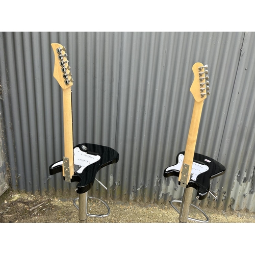 150 - A pair of unusual decorative stools crafted from electric guitars