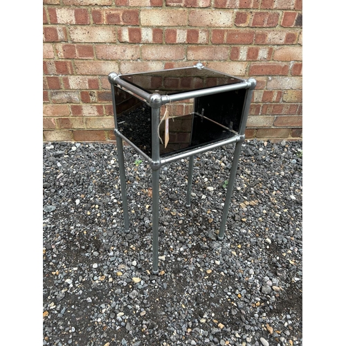 16 - An Art Deco chrome and black glass bedside/side table