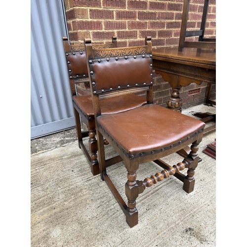 17 - An early 20th century oak drawer leaf dining table together with a set of five chairs