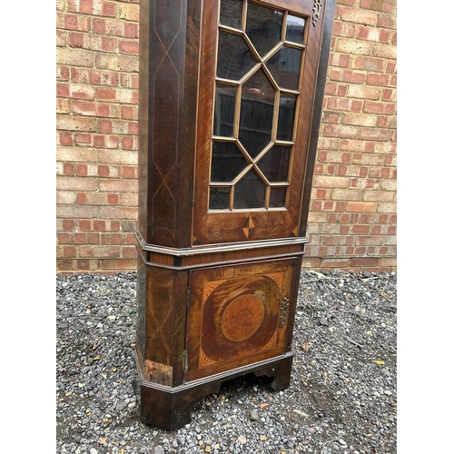 17a - An Irish George III and later mahogany standing corner cupboard