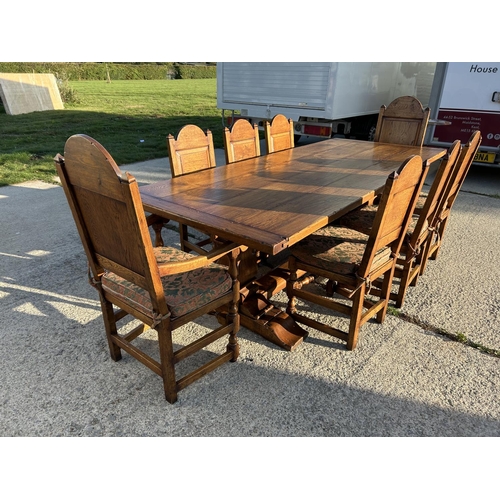 18 - A high quality oak refectory table measuring 265x108 together with a set of 8 matching panel back oa... 