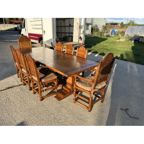 18 - A high quality oak refectory table measuring 265x108 together with a set of 8 matching panel back oa... 