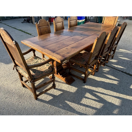 18 - A high quality oak refectory table measuring 265x108 together with a set of 8 matching panel back oa... 