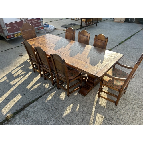 18 - A high quality oak refectory table measuring 265x108 together with a set of 8 matching panel back oa... 