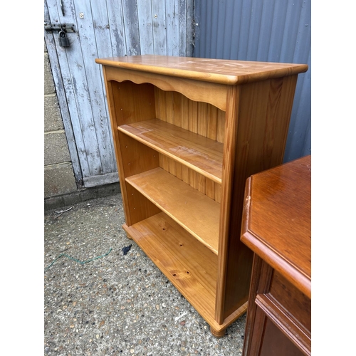 180 - A reproduction single drawer hall cupboard together with a open bookcase