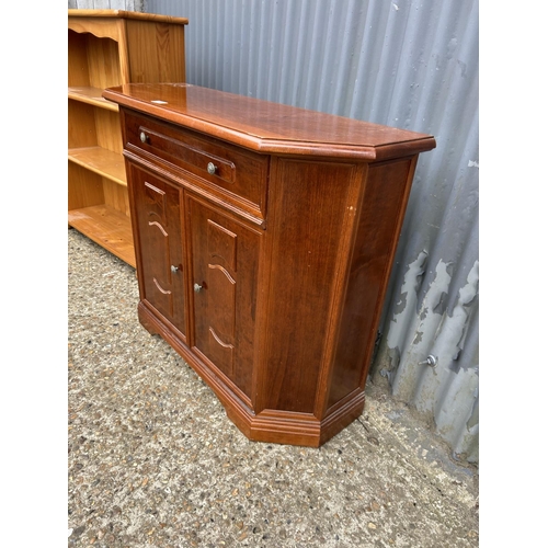 180 - A reproduction single drawer hall cupboard together with a open bookcase