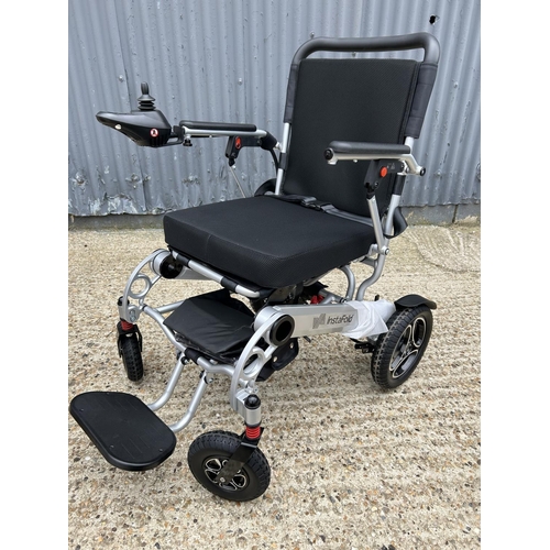 186 - A LIVEWELL insafold folding electric wheelchair hardly used with power packs and charger