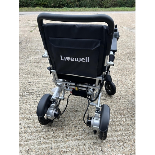 186 - A LIVEWELL insafold folding electric wheelchair hardly used with power packs and charger