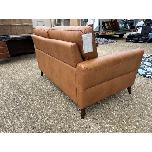 189 - A modern tan brown leather two seat sofa with adjustable head supports