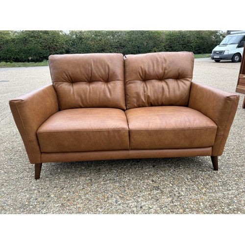 189 - A modern tan brown leather two seat sofa with adjustable head supports