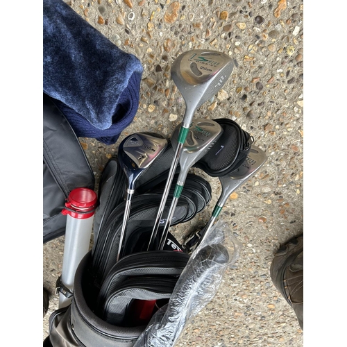 195 - A set of WILSON golf clubs and putters in bag