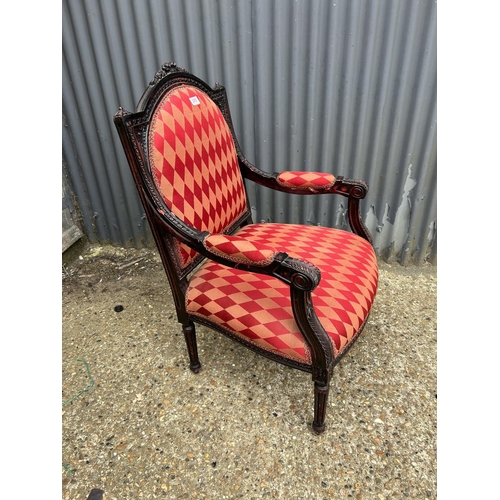 205 - A carved frame throne chair with red diamond pattern