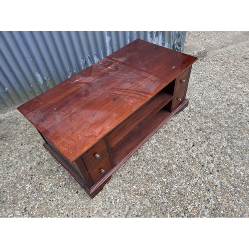 207 - A reproduction mahogany double sided coffee table with four drawers to each side 124x 63x50