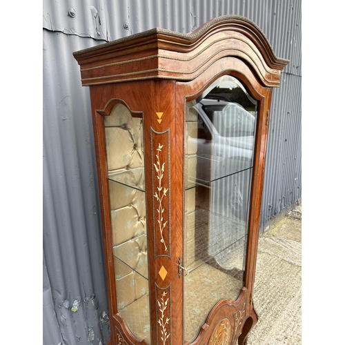 208 - An inlaid Kingwood display cabinet with glass internal shelves and gilt mounts 82x50x190