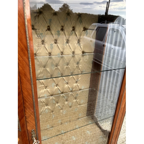 208 - An inlaid Kingwood display cabinet with glass internal shelves and gilt mounts 82x50x190