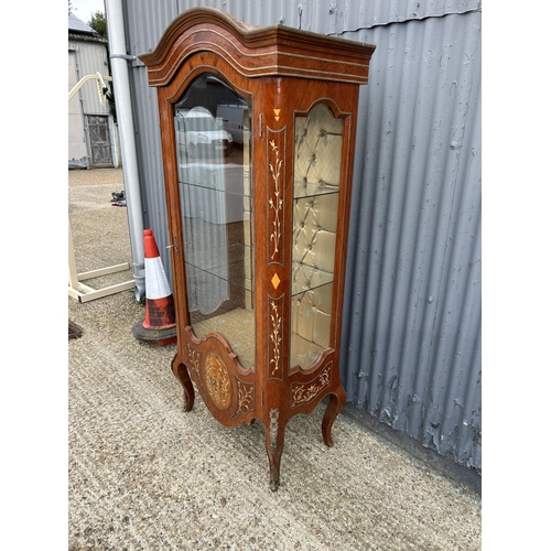 208 - An inlaid Kingwood display cabinet with glass internal shelves and gilt mounts 82x50x190