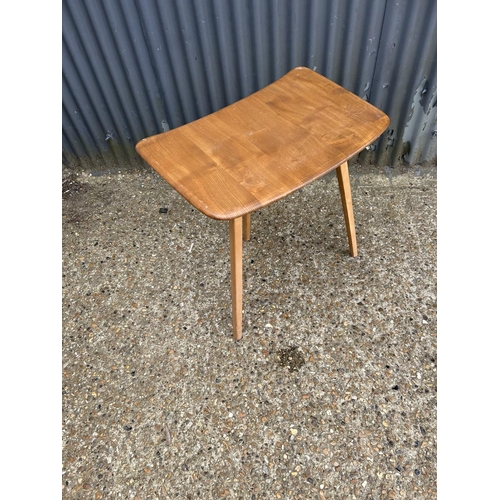 213 - A mid century ercol three leg writing table