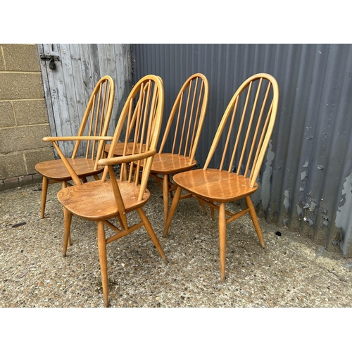 215 - A set of five ercol stick back kitchen chairs inc one carver