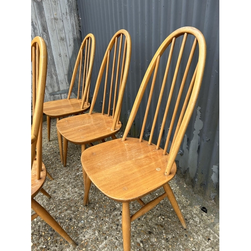 215 - A set of five ercol stick back kitchen chairs inc one carver