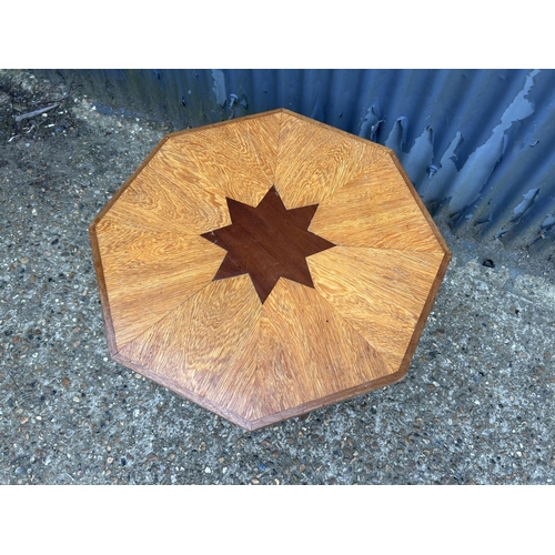 220 - A light oak occasional table inlaid with star