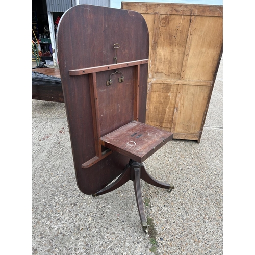 225 - A Victorian mahogany tilt top breakfast table, size 152 x 100. Some damage to crossbanding