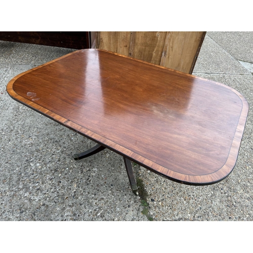 225 - A Victorian mahogany tilt top breakfast table, size 152 x 100. Some damage to crossbanding