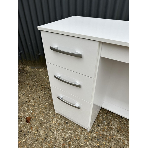 229 - A modern high gloss white three drawer kneehole desk