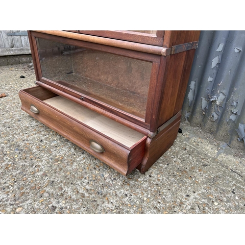 232 - An original GLOBE  WERNICKE Mahogany three section stacking bookcase with drawer  86x30 x120