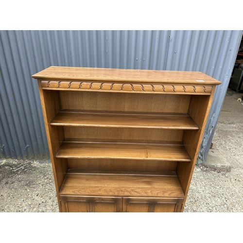 237 - An ercol golden dawn open front bookcase 102x30x140