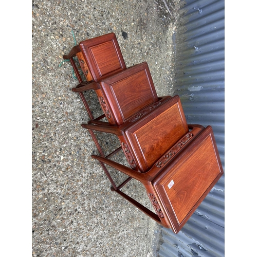 246 - An oriental hardwood nest of four occasional tables