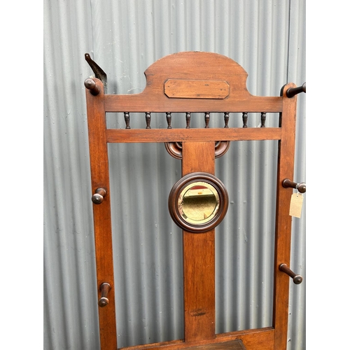 266 - An Edwardian mahogany hallstand with circular mirror