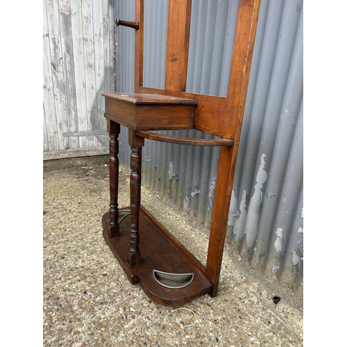 266 - An Edwardian mahogany hallstand with circular mirror