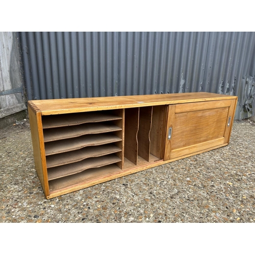 271 - A vintage oak filing / record storage cupboard with two sliding doors