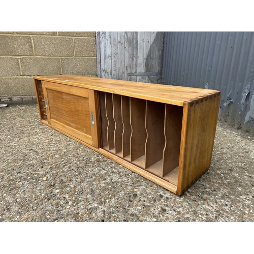 271 - A vintage oak filing / record storage cupboard with two sliding doors