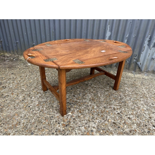 276 - A reproduction mahogany tray top military style coffee table