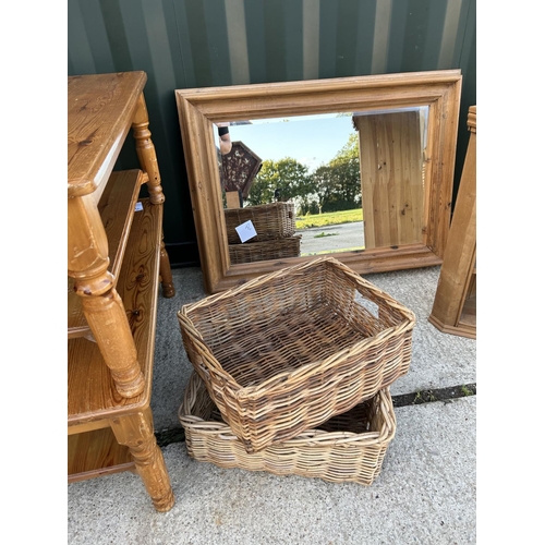 28 - A good quality large pine framed mirror together with two pine coffee tables, two baskets and a pine... 